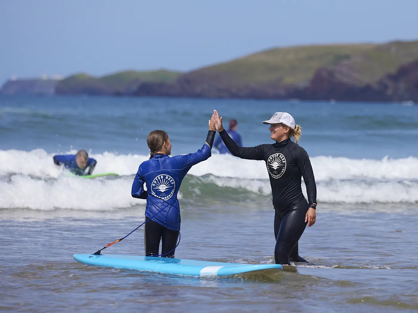 Beginner surfer learning how to pop up on a surfboard